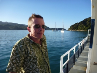 Relaxing on deck after an arm-aching day of kayaking. If the smile looks a little tight, that'll be the residual seasickness