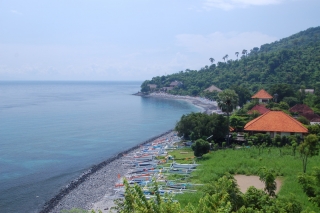 The Amed coast - indigo ocean, cerulean sky, viridian forest and colourful fishing boats on the beach
