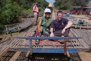 The bamboo train - like a bamboo barn door resting on two toy train axles.  Note the lack of sides