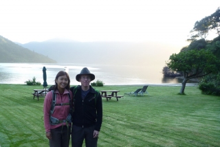 A photo on the lawn of Mahana Lodge at dawn, ready for our second day on the Queen Charlotte Track